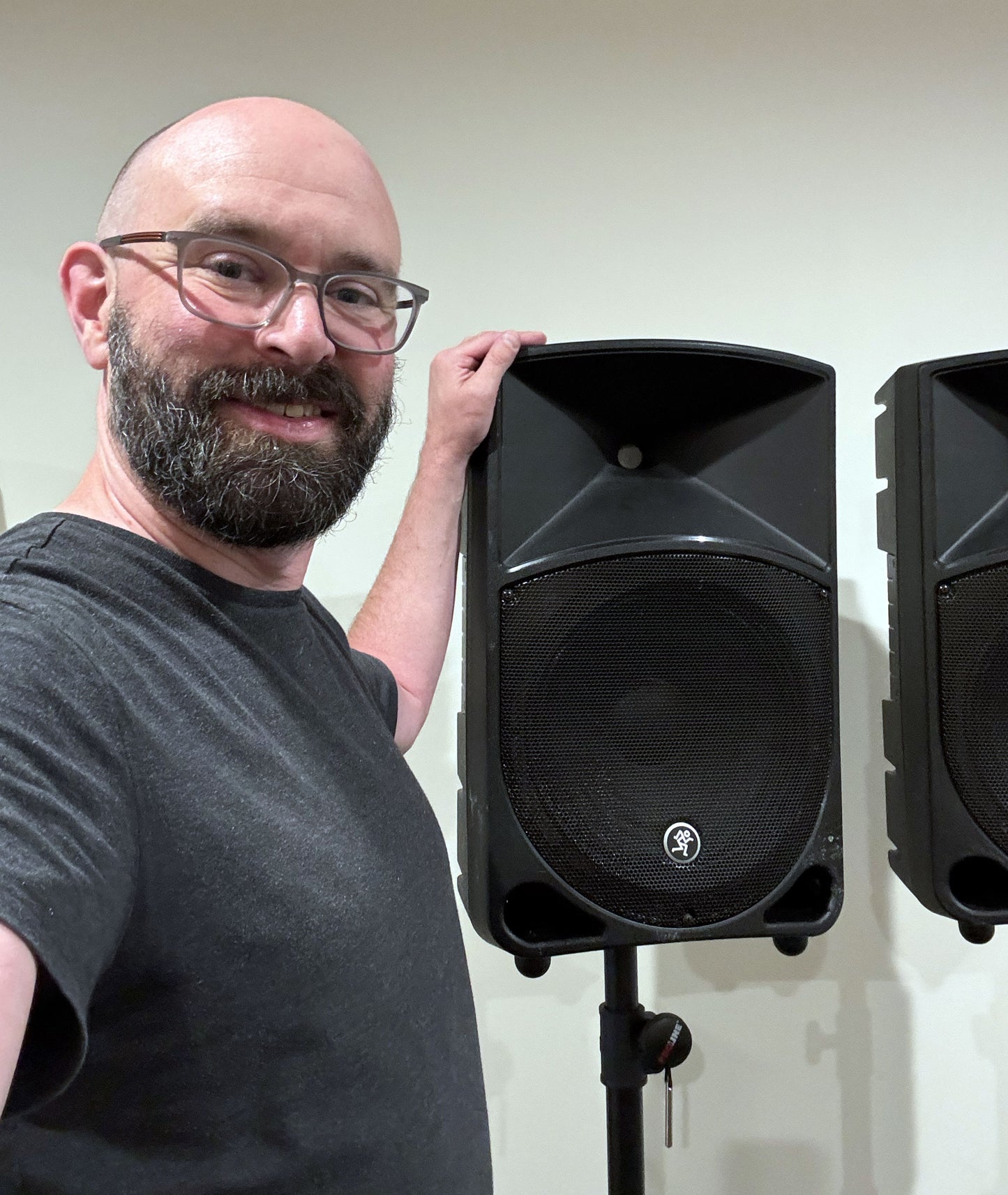Pair of Mackie Thump12 12" powered PA speakers with two adjustable tripod speaker stands