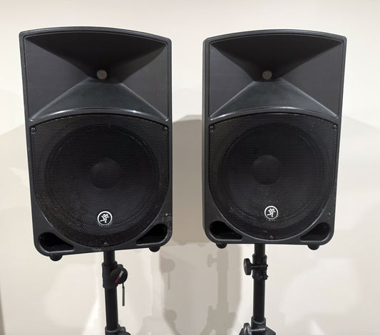 Pair of Mackie Thump12 12" powered PA speakers with two adjustable tripod speaker stands