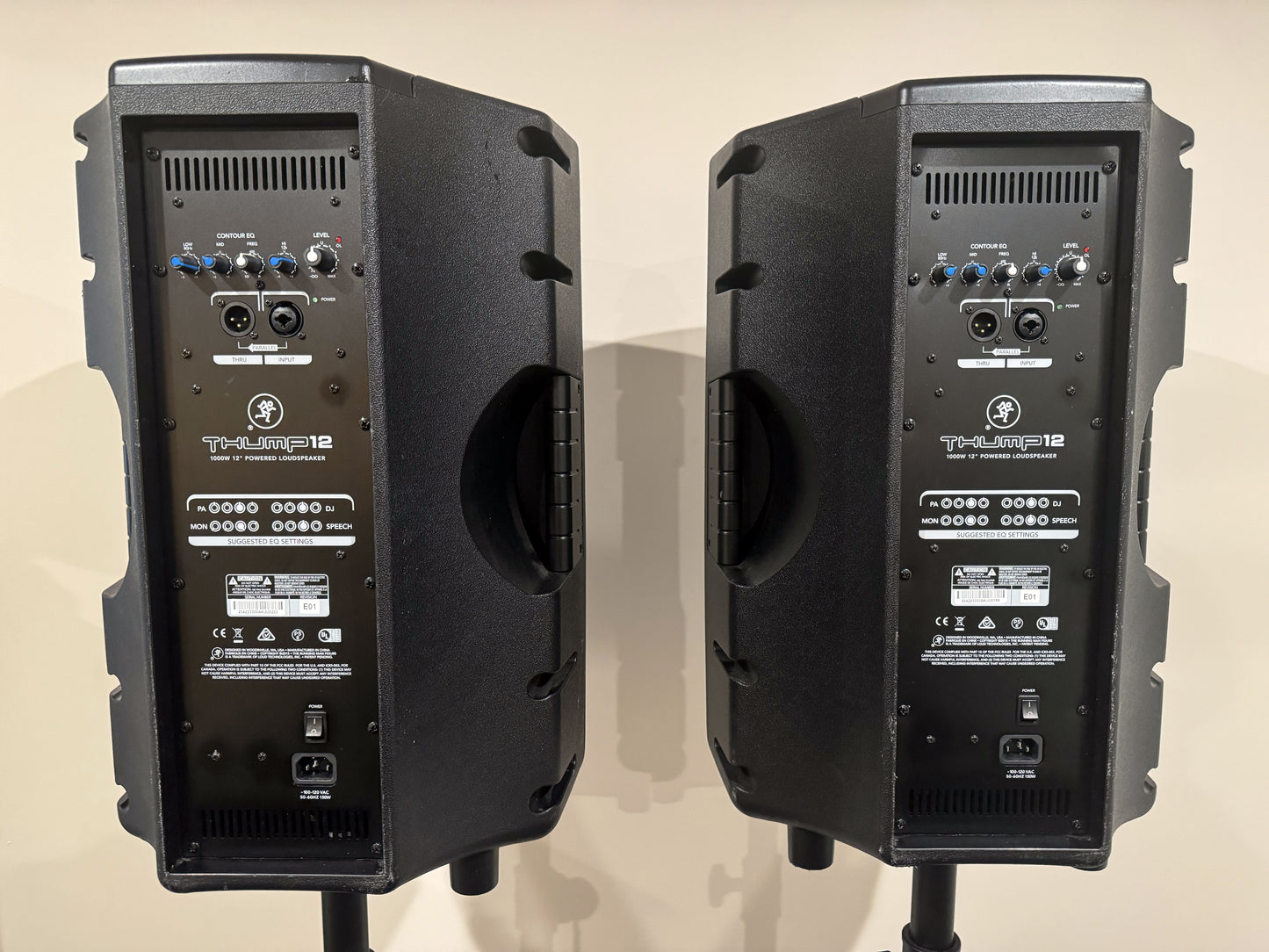 Pair of Mackie Thump12 12" powered PA speakers with two adjustable tripod speaker stands