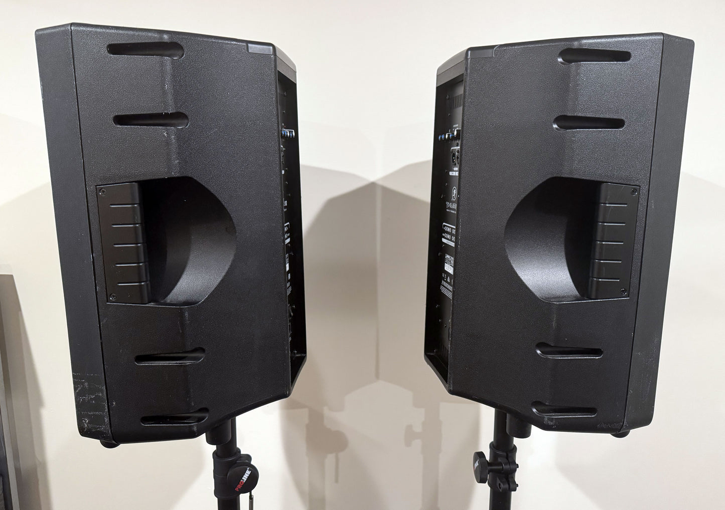 Pair of Mackie Thump12 12" powered PA speakers with two adjustable tripod speaker stands