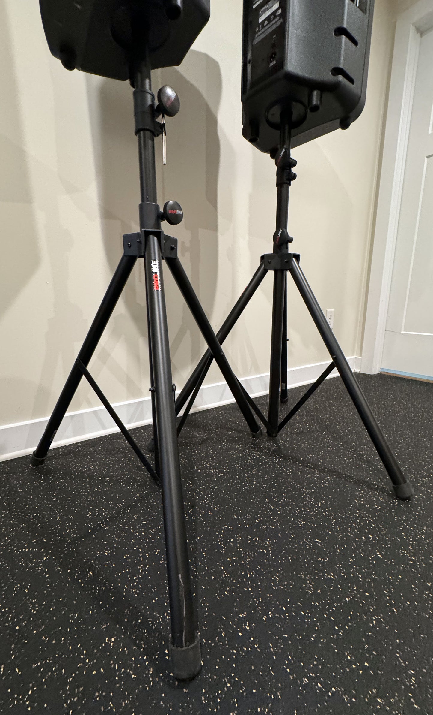 Pair of Mackie Thump12 12" powered PA speakers with two adjustable tripod speaker stands